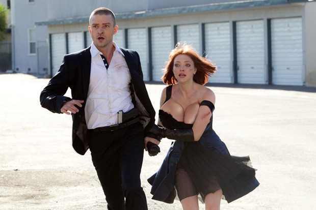 Sylvia Weis (Amanda Seyfried) and Will Salas (Justin Timberlake) running from some cops in 'In Time'(2011). Amanda Seyfried's boobs are morphed to be J-Cups and they are nearly spilling out of her dress, one strap already sliding down her upper arm, revealing her bouncing tits nearly splilling out of her dress.